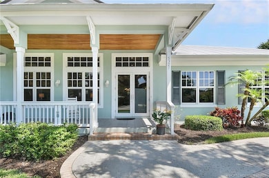Welcoming front porch with tongue-and-groove ceili