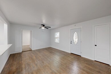 Foyer entrance featuring hardwood / wood-style flo