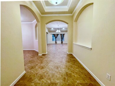 This photo showcases a spacious hallway with arche