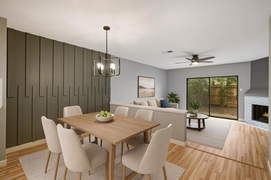 Spare room featuring wood finished floors, basebo