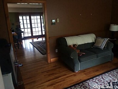Living Room. Open living room with door way to fam