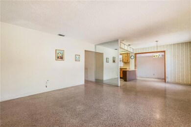 Entrance open to large living room, dining room, k
