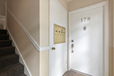 The interior entrance features a sleek door with a