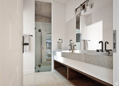 Bathroom featuring double vanity, a shower stall, and light tile patterned flooring