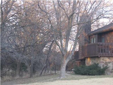 LIVING ROOM DECK OVERLOOKS TREES AND CREEK. WILDLI