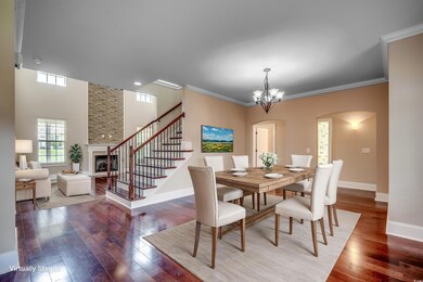 Dining room featuring ornamental molding, an invit