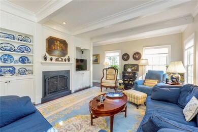 Living room with coffered ceiling, built-ins and g