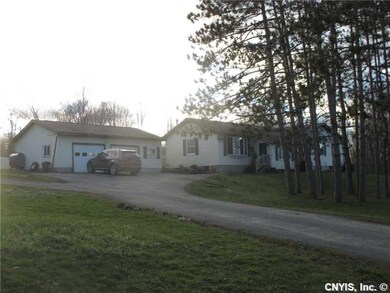 Exterior Front. Spacious paved driveway offers ple