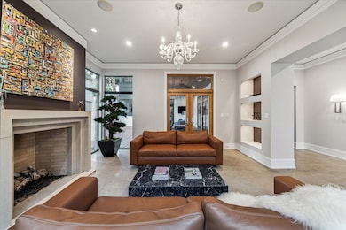 This room features the oversized gas log fireplace