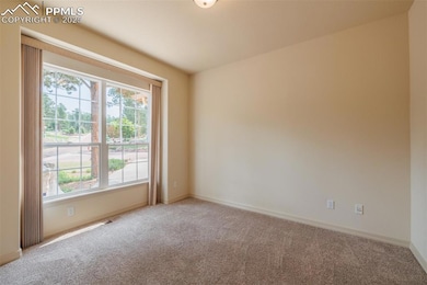 Fabulous office space with french doors off the foyer. Large picture window with view of the pines