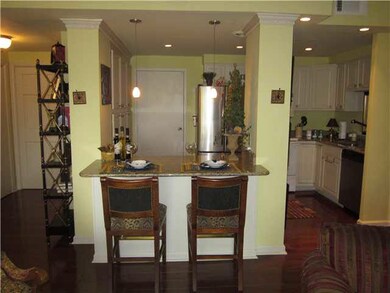 Open floor plan breakfast bar features granite cou