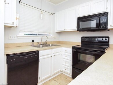 Kitchen with ceramic tile, newer appliances and fresh paint