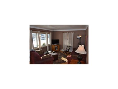 Living Room. The cozy front living room has hardwo