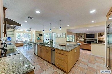 The amazing kitchen is 32 feet long and boasts a s