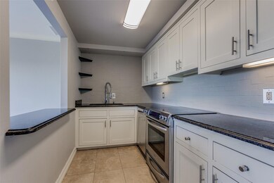 Kitchen opens to living-dining area