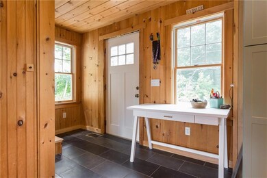 With wood floors, ceilings and...