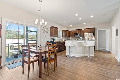 Dining room featuring recessed lighting, an inviti