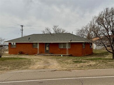 View of front of home featuring covered porch, bri