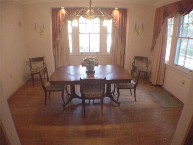 Another view of the dining room reveals a long wid