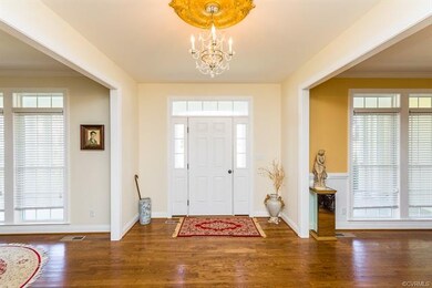 Entry hall with chandelier.