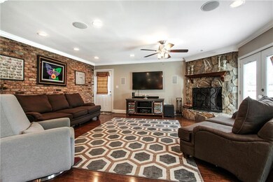 LARGE DEN WITH GAS FIREPLACE AND FRENCH DOORS TO P