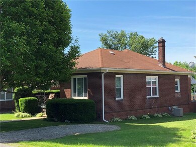 Front and right side view of home with off street 