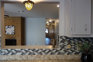 Breakfast bar with open concept into the living an