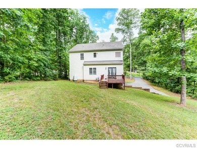 Spacious back yard surrounded by trees for privacy