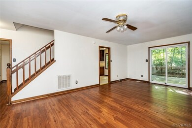 Unfurnished living room with dark hardwood / wood-