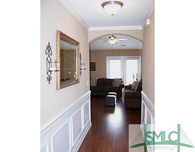 Other. Beautiful trim work in the foyer leading to