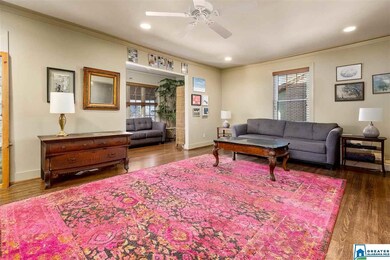 Spacious room with hardwood flooring throughout.
