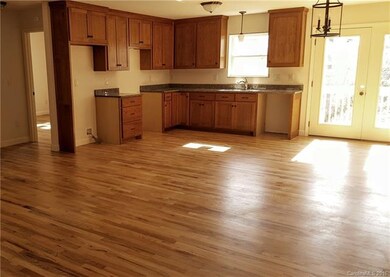beautiful hardwood floor and lovely kitchen