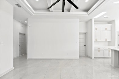 Empty room with a raised ceiling
