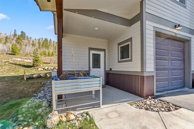 Doorway to property with a garage