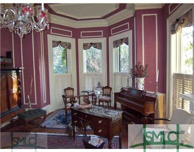 Living Room. A view of the parlor bay windows and 