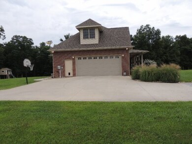 GARAGE SIDE VIEW- CONCRETE DRIVE