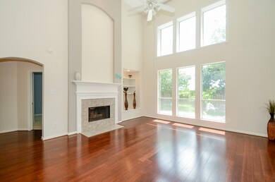 There is an abundance of natural light in this spacious living area! Display your favorite photo of work of art above this beautiful fire place!