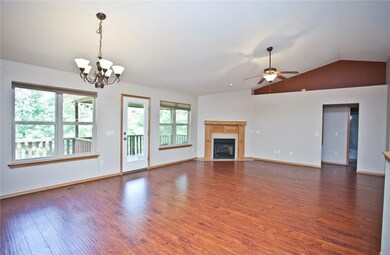Fireplace in the living room with balcony patio entrance.