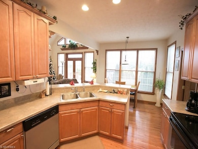 Kitchen with Oak Hardwood Floor and Maple Cabinets