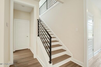 Photo is of a similar home,