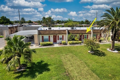 View of front of property with a front lawn and stucco siding