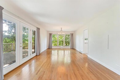 Spacious living area 1 with hardwood and entrance 