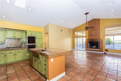 Great-room with Spanish tile flooring and raised fireplace