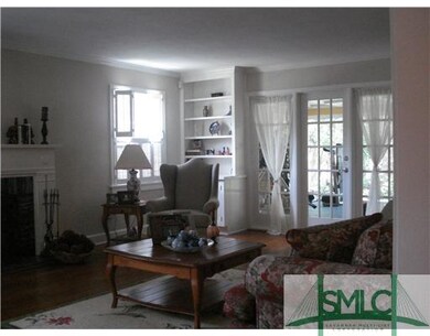 Living Room. Doors to screened and heated sunroom 