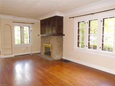 Living room with gorgeous wood floors, over sized 