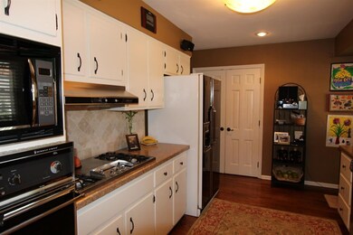 The kitchen has a beautiful tile backsplash.