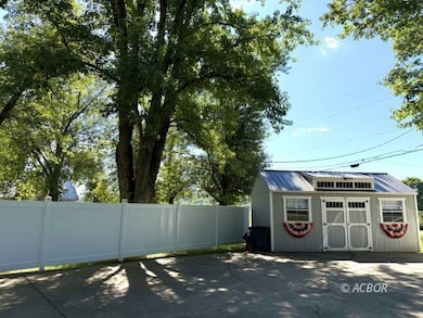 Outbuilding and fence