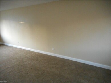 Another picture of the living room. Neutral dcor.