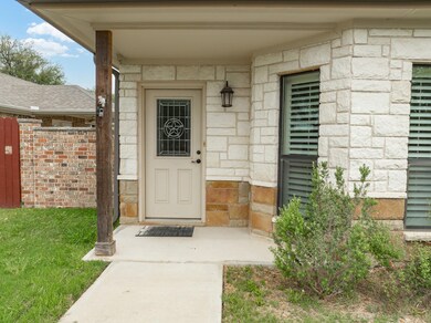Property entrance featuring stone siding