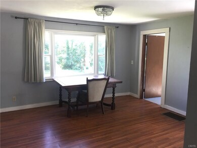 Dining room with large windows over looking back y